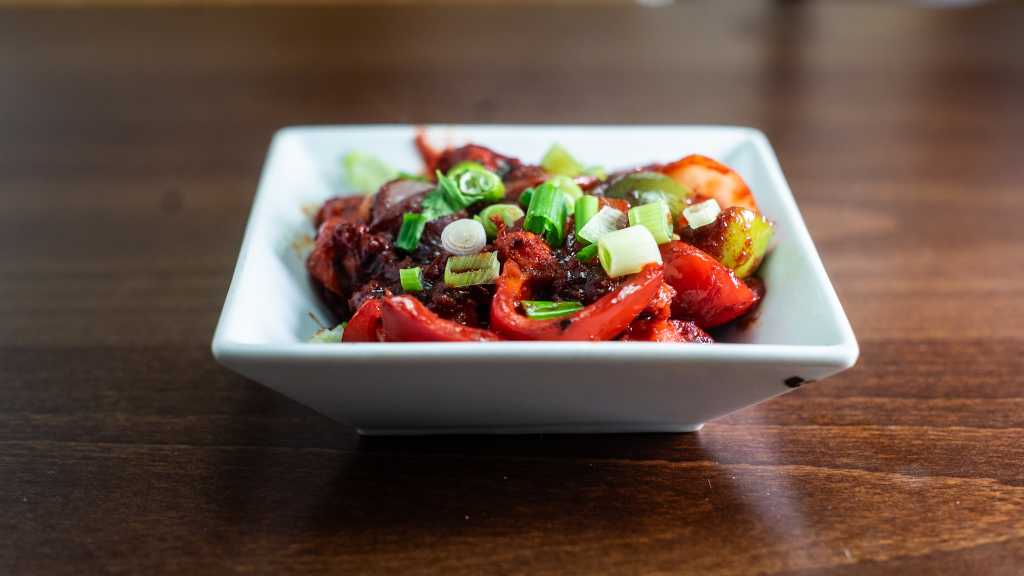 Chilli paneer with peppers and spring onions