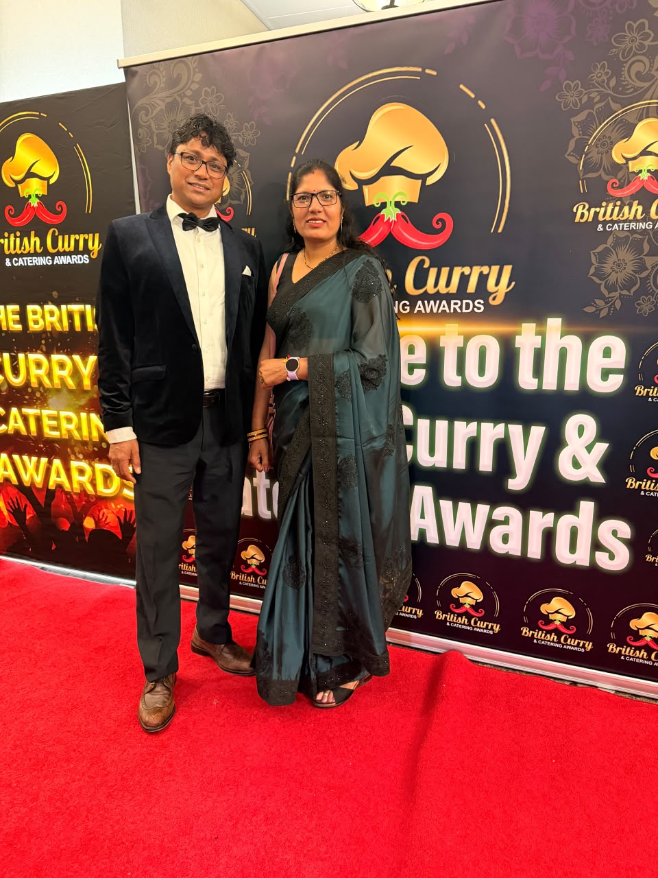 Two DCC representatives celebrating at the British Curry & Catering Awards event