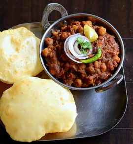 Chole bhature with spiced chickpeas and fried bread