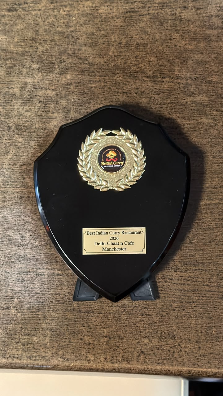 Award plaque reading Best Indian Curry Restaurant 2026, Delhi Chaat n Cafe, Manchester